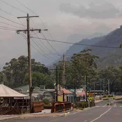 Bushfire under control, but people told not to return