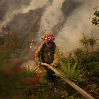 LA races to contain fires before extreme winds return