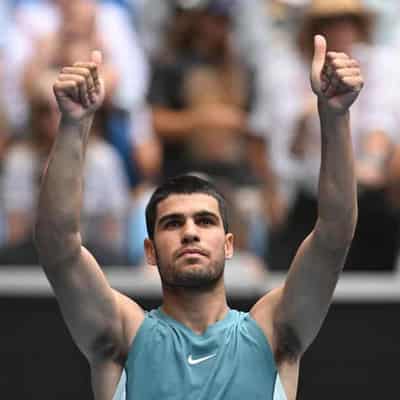 Big guns Alcaraz, Djokovic through to Open third round