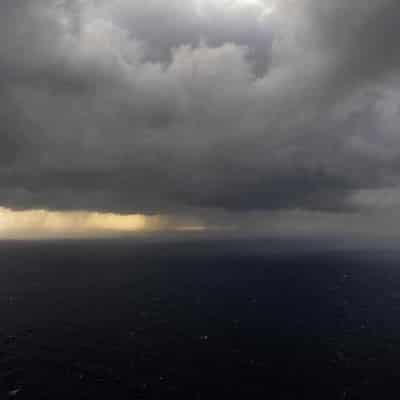 Cyclone off WA, flood search in NSW as Qld dams spill