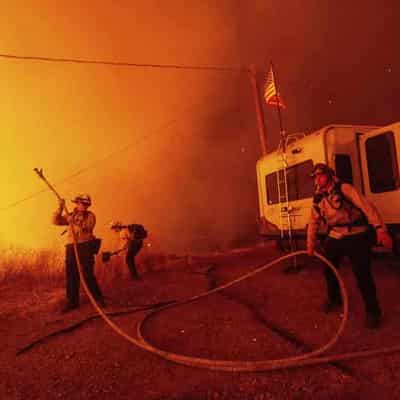 Fires fought as devastated Los Angeles picks up pieces