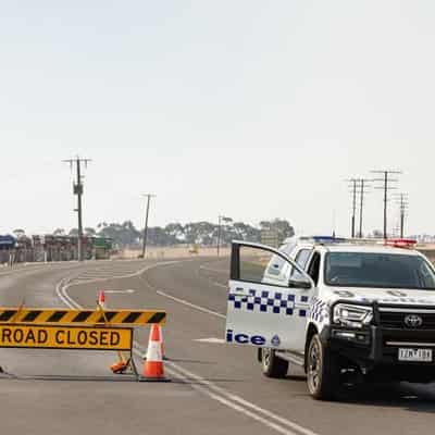 Bushfires rage as town takes stock after major scare