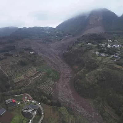 Rescuers search for 30 after a landslide in China