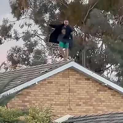 Probe into alleged murder after tense rooftop stand-off