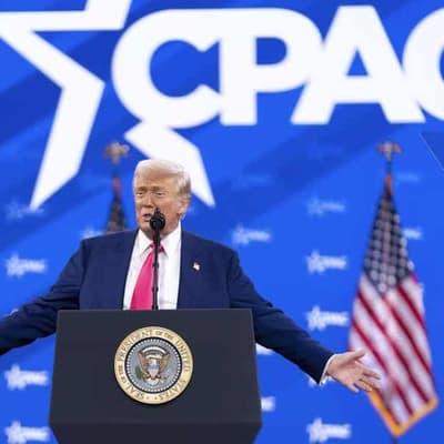 Trump revels in mass federal firings and jeers at Biden