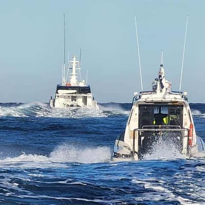 Massive search for fisherman pulled overboard by shark