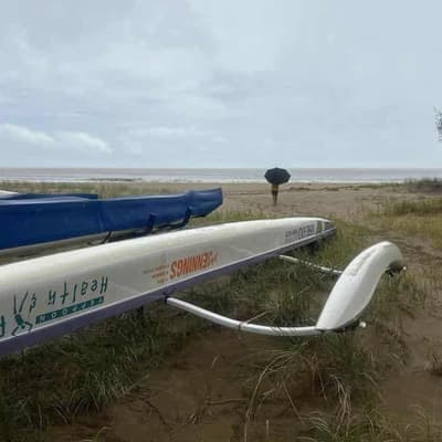 Damaging surf and high tides as cyclone spirals closer