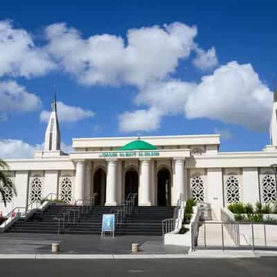 Mosque unveiling tainted by alleged massacre taunt