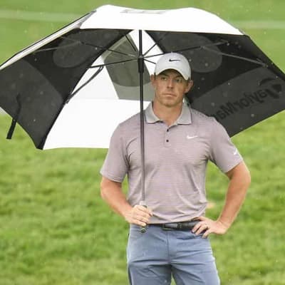 McIlroy leads as bad weather halts The Players