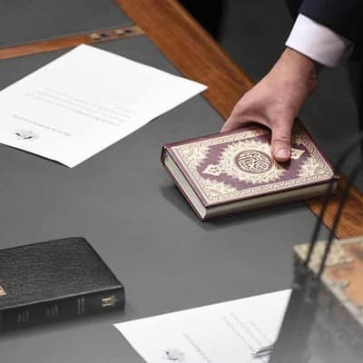 Constitution doesn't prevent MPs being sworn in holding Koran