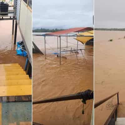 Flood drama as panicked residents plucked from roofs