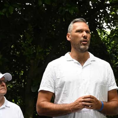 Towering presence, missing minister as PM visits reef