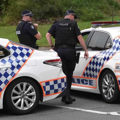 Two dead, carer charged after car crashes into tree