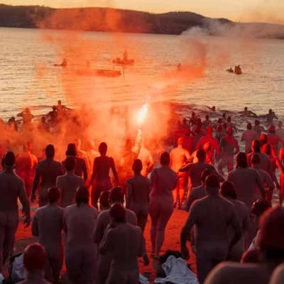 Primal moment: nudes brave icy waters for solstice swim
