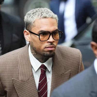 Singer Chris Brown denies lesser 'bottle attack' charge