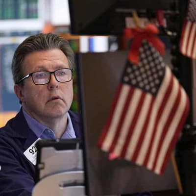 Wall Street ends higher after choppy trading