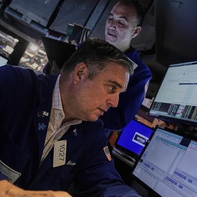 Wall Street closes mixed following choppy trading