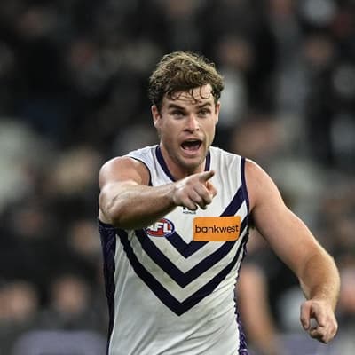 Dog and Dogga all smiles as Sean Darcy hits his straps