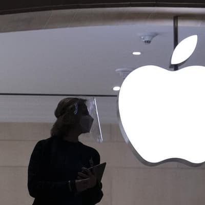 Wall Street ends higher, led by Nasdaq, as Apple jumps