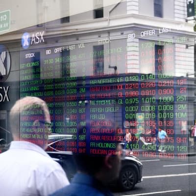 Australian shares higher as central bank cuts rates