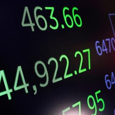 Wall Street down as investors brace for Powell's speech