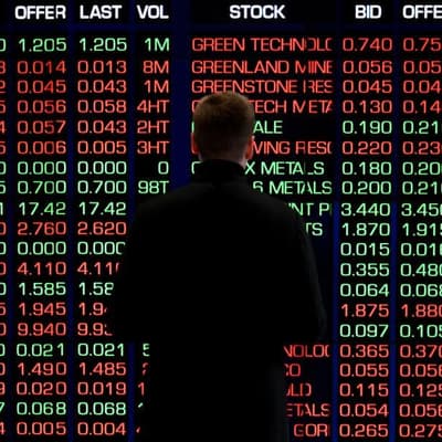 Australian shares slip but secure record weekly close