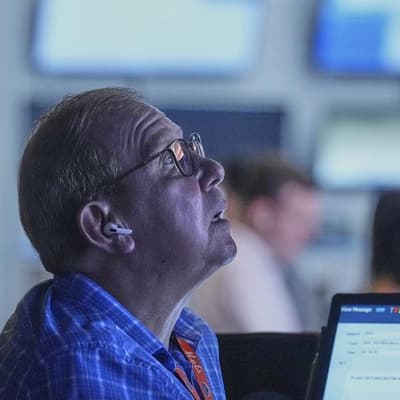 Wall Street ends lower as tariff ruling raises worries