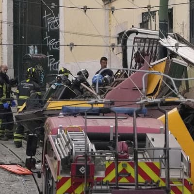Famed Lisbon streetcar derails and crashes, killing 15