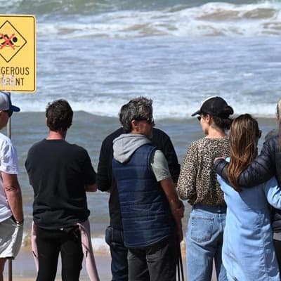 Twin of surfer killed by shark shares emotional tribute