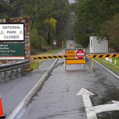 Locals plead for visitors to return to area of manhunt