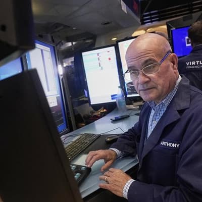 Wall Street hits highs as Intel soars on Nvidia stake