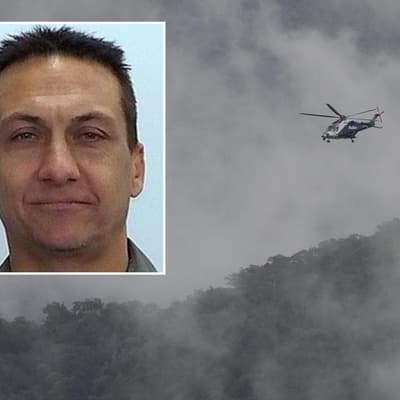 Hunt for cop killer continues as national park reopens