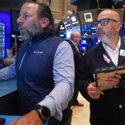 Wall Street ends sharply higher on upbeat earnings