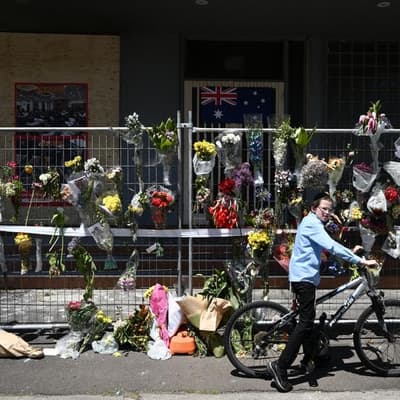 Premier backs down on protester face mask ban