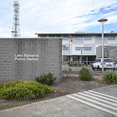 Woman found dead in car parked outside police station