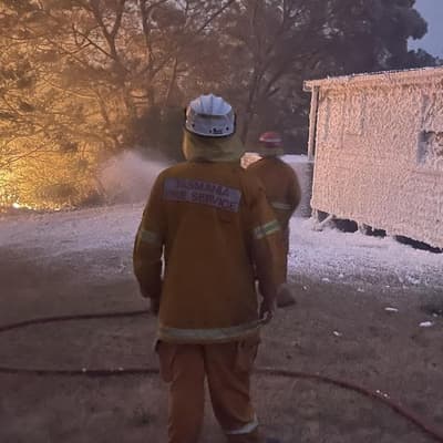 Smoke signal to mainland as fire threatens coastal town