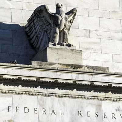 Divided US central bank cuts rate, signals pause