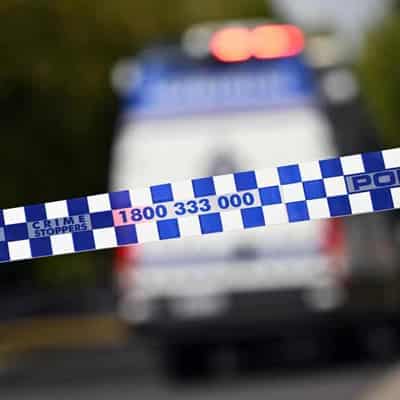 Man shot dead while sitting in car in suburban Sydney