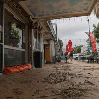 Floods, cyclone put New Zealand in slender recession