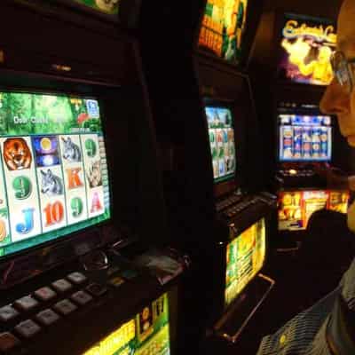 NSW cuts pokie numbers, cash feed-in limits