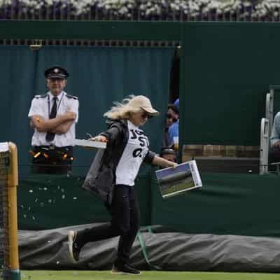 Aussie Saville's match at Wimbledon hit by protester