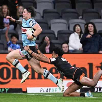 Sharks race away from spirited Tigers for 36-12 NRL win