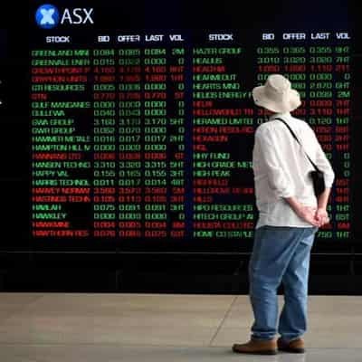 Australian stocks sink as Bank of Japan tweaks policy