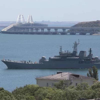 Russian warship fires warning shots at cargo ship