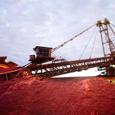 BHP warns on tax, productivity after plunge in profits