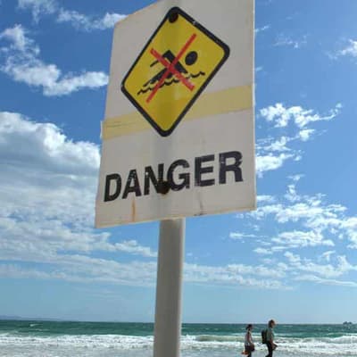 Surfer in critical condition after shark attacks leg
