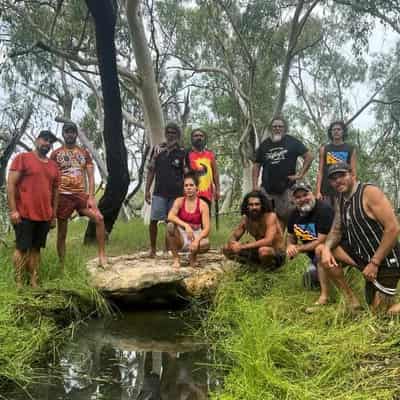 Ceremonial campfire still burns next door to coal mine