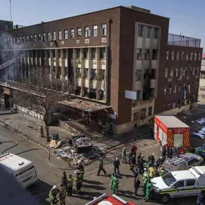 Dozens dead as fire guts South African apartment block