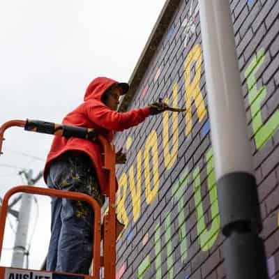 Artists painting the streets to lose height cover