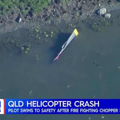 Water-bombing chopper crashes in dam, pilot unhurt